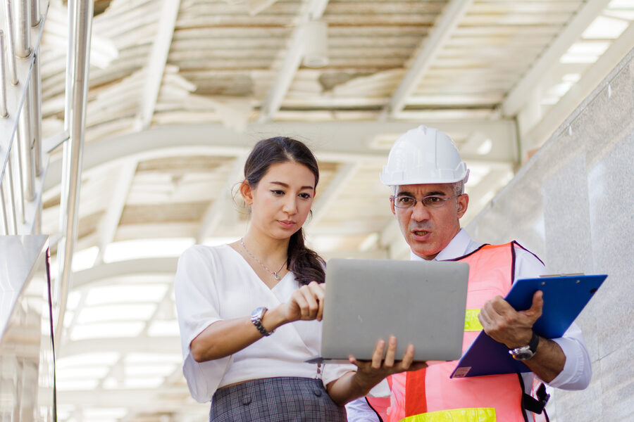 Construction site team reviewing plans on a remote job site