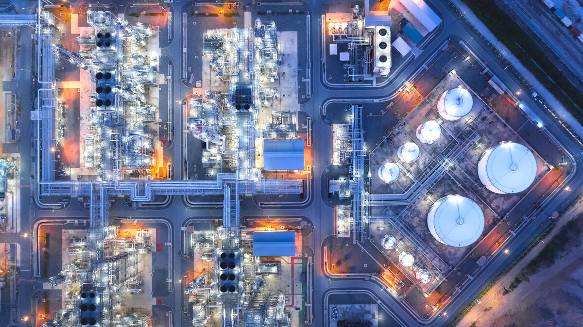 Aerial view of oil and gas facility at dusk
