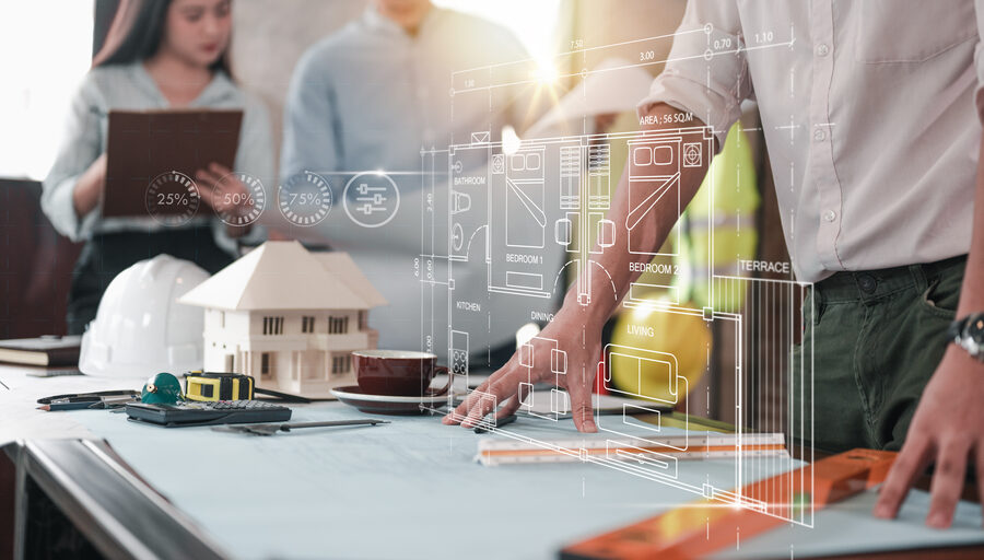 Architectural drawings and blueprints spread across a design table